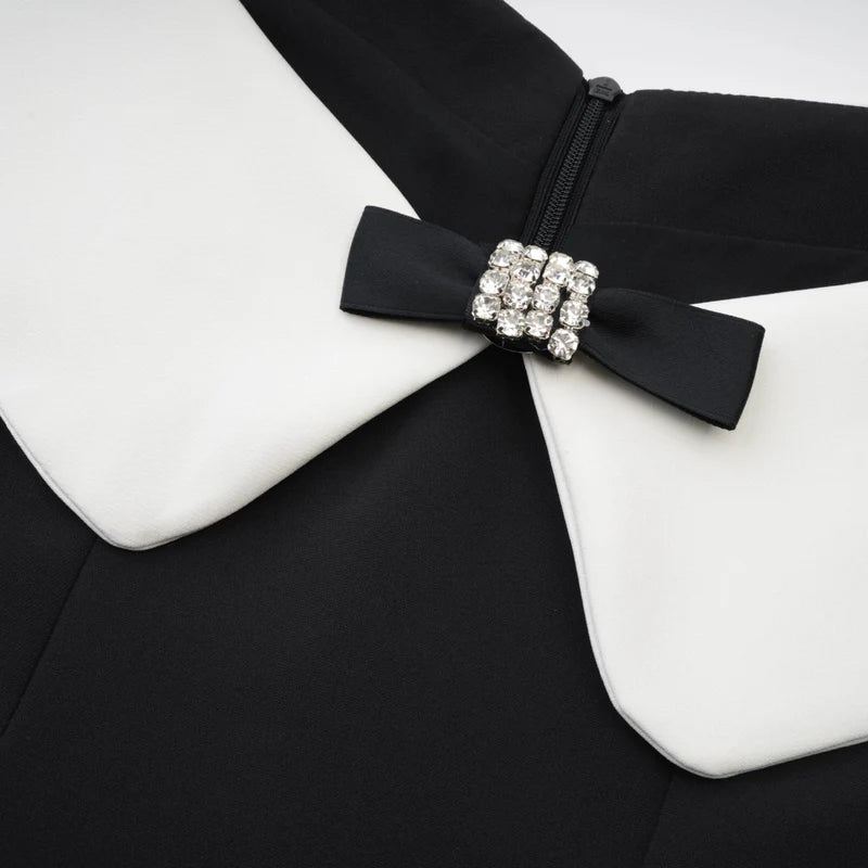 Deniece mini robe noire à l'épaule