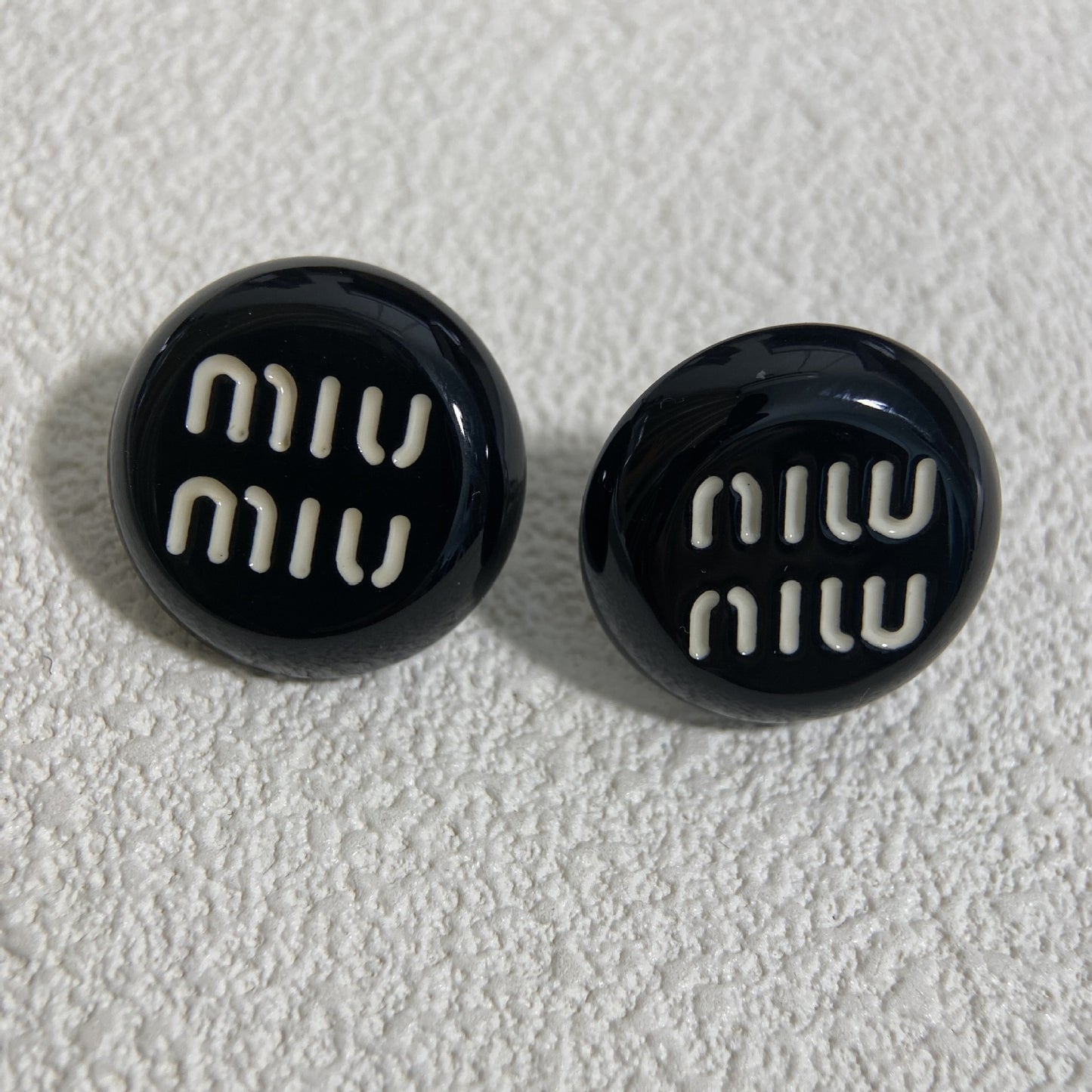 Black and white letter round earrings