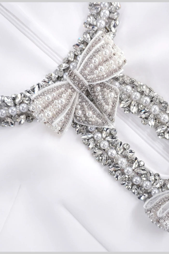 Sleeveless Mini Dress With Intricate Sparkling Neckline And Bow Embellishments - White