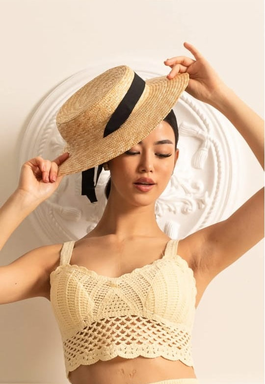Wide-Brimmed Straw Hat With Black Ribbon Accent
