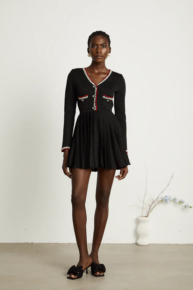 Auille tricotée de mini robe plissée