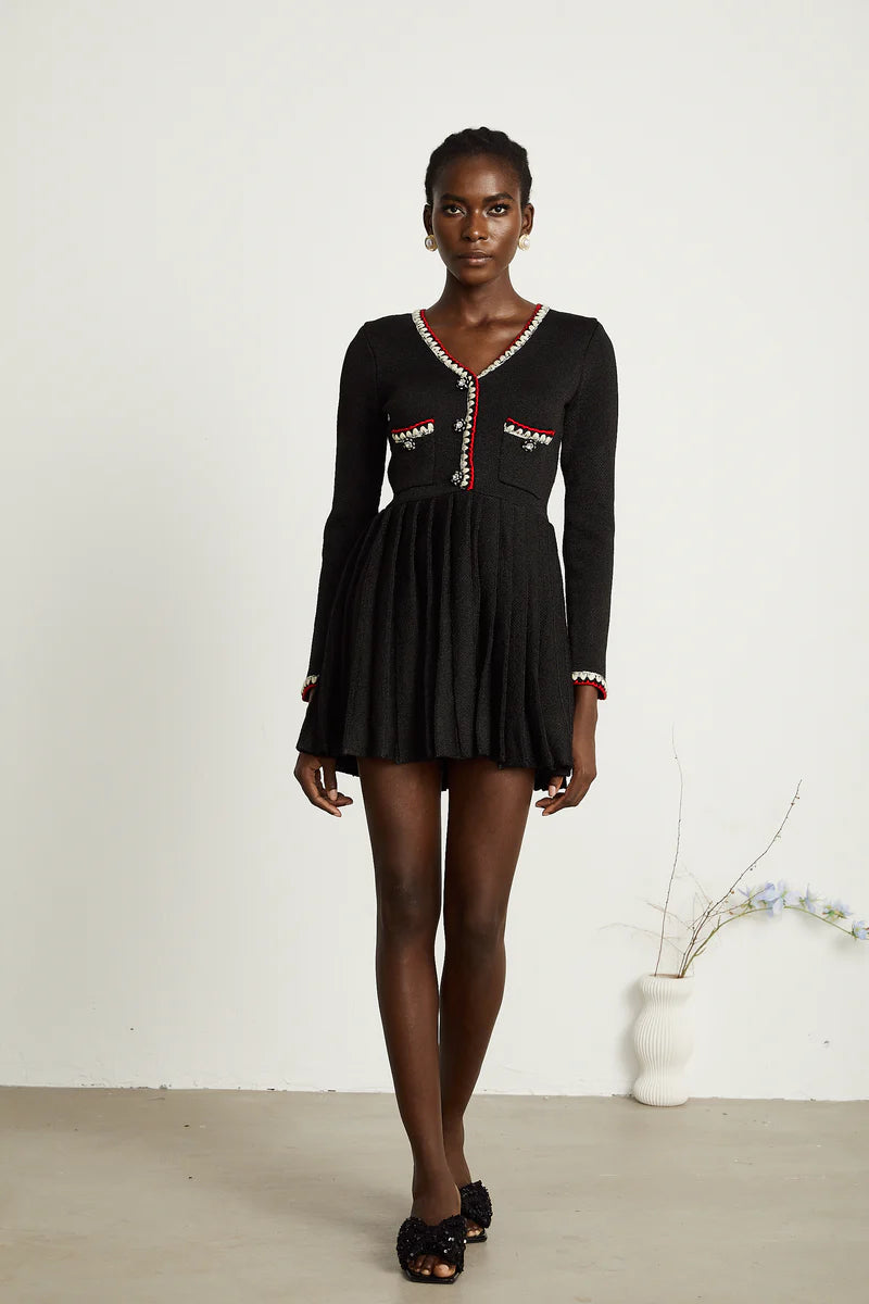 Auille tricotée de mini robe plissée