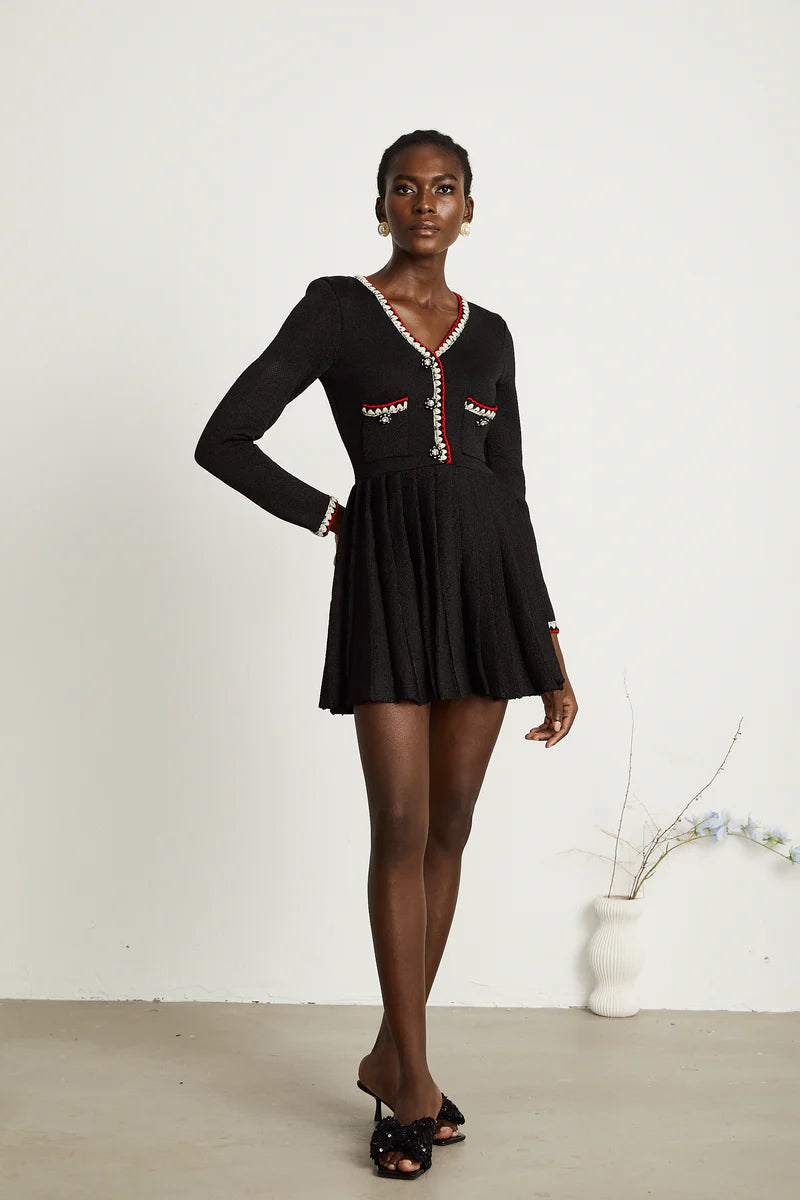 Auille tricotée de mini robe plissée